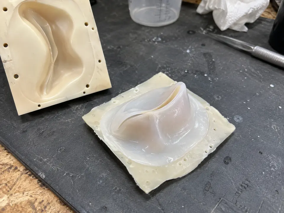 The silicone valve beside one mould face.
