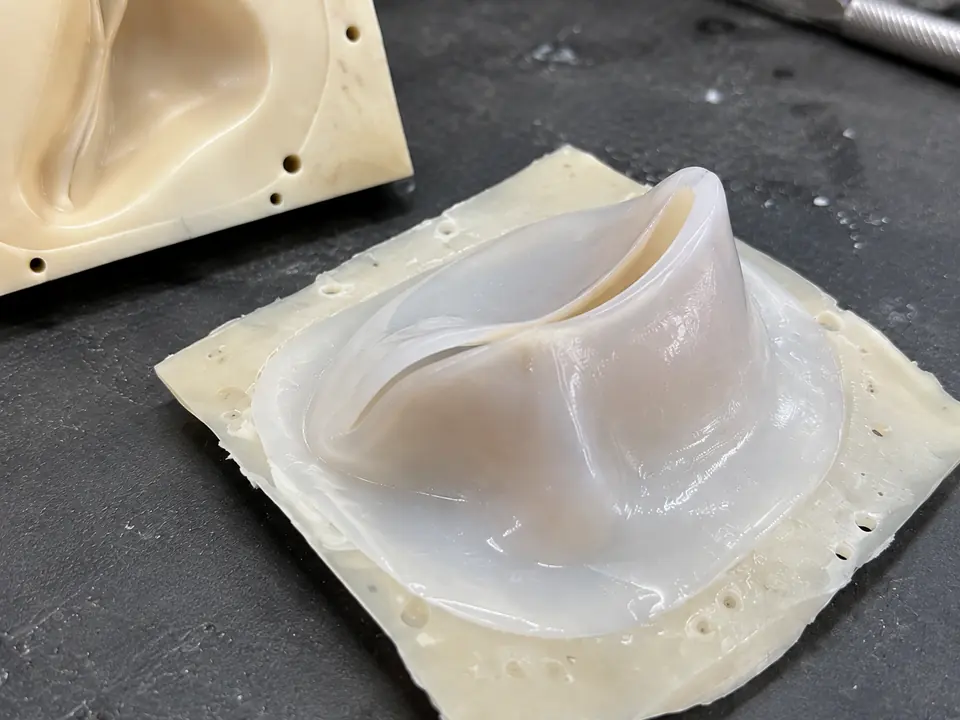 Thin curved sections and the cast silicone surface.